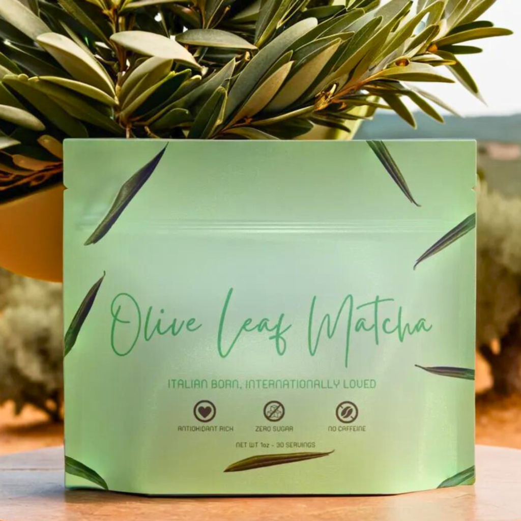 Image of Olive leaf matcha tea pouch. Olive Leaf Matcha stands out for its exceptional qualities: crafted in Italy from 100% handpicked Olea europaea leaves, it embodies wellness with its potent health benefits. This innovative tea, inspired by chefs and driven by culinary creativity, is not only environmentally sustainable but also holds international appeal. Rigorously third-party tested to ensure superior nutritional quality, Olive Leaf Matcha is a pure, filler-free beverage that represents the pinnacle of tea innovation.